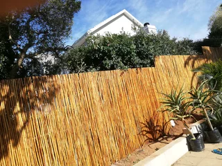 Wooden fence latle bamboo and Roll on grass