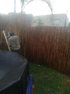 Wooden fence latle bamboo and Roll on grass