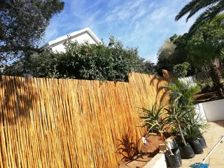 Wooden fence latle bamboo and Roll on grass