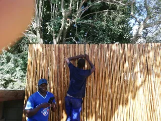 Wooden fence latle bamboo and Roll on grass