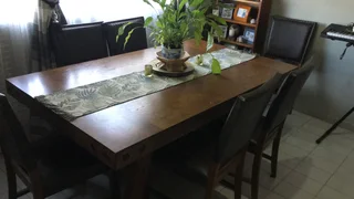 6 seater solid wood dining room table with leather seats