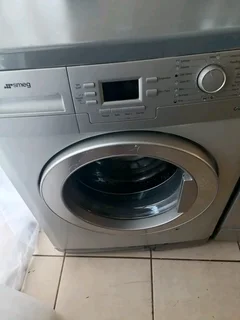 Silver Smeg front loader washing machine
