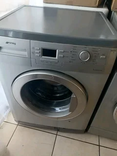 Silver Smeg front loader washing machine