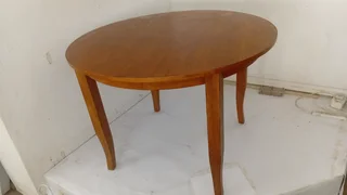 Round wooden table in good condition.Nice wood and polishes up nicely.PLUS Oak chair