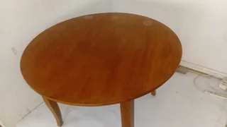 Round wooden table in good condition.Nice wood and polishes up nicely.PLUS Oak chair