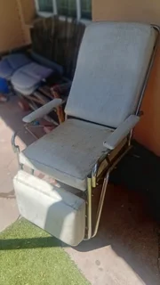 Reclining studio chair  chrome and leather(?)in fair condition ,with fully manual reclining action