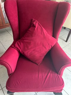 Red velvet wing back chair