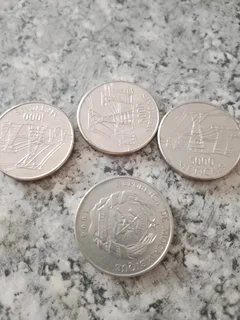 If anyone is interested in these Mozambican coins 3 X 5000 and 1 X 500 the current value in Rand
