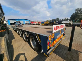 2017 PARAMOUNT QUAD AXLE SLOPE DECK WITH SINGLE AXLE DOLLY