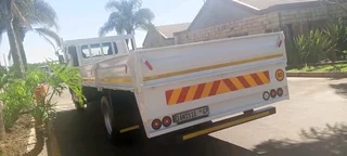 2010 NISSAN UD UD100 DROPSIDE TRUCK