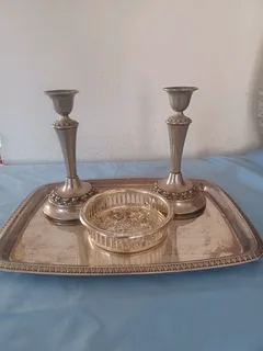 Silver candle holders and trays.