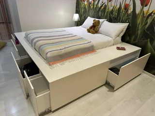 Modern double bed with storage draws