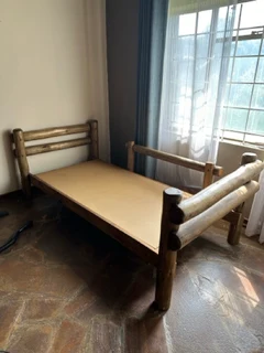 Two single Gum pole /wooden Beds