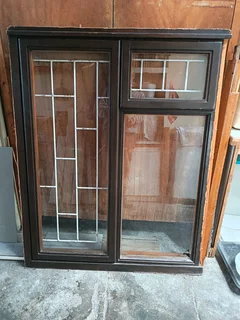 Meranti Window 1,2m highx1m wide with burglar bars (one glass pane broken)