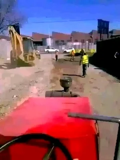 Tar surfacing and brick paving