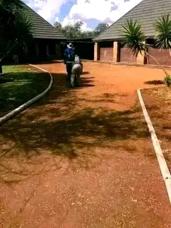 Tar surfacing and brick paving