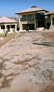 Tar surfacing and brick paving