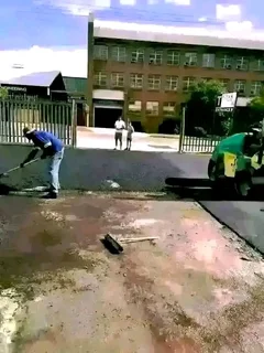 Tar surfacing and brick paving