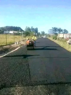 Tar surfacing and brick paving