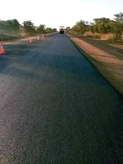 Tar surfacing and brick paving.