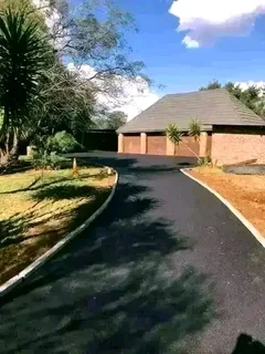 Tar surfacing and brick paving.