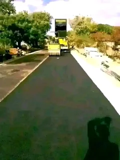 Tar surfacing and brick paving.