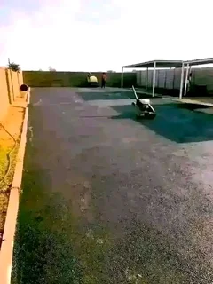 Tar surfacing and brick paving.