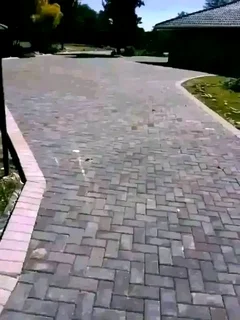 Tar surfacing and brick paving.