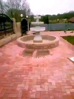 Tar surfacing and brick paving.