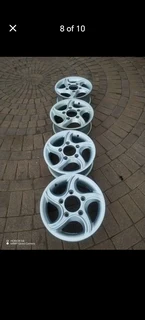 16Inch MAHINDRA Magrims 5Holes Silver a set of four on sale.