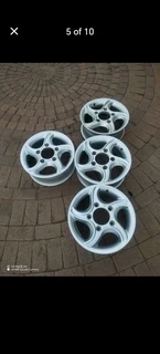 16Inch MAHINDRA Magrims 5Holes Silver a set of four on sale.