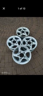 16Inch MAHINDRA Magrims 5Holes Silver a set of four on sale.