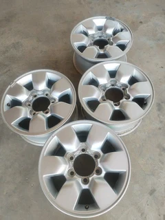 15 inch t o y o t a h i l l u x magrims 6 holes w t h n o c e n t r e c a p s a set of four on sale