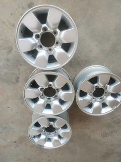 15 inch t o y o t a h i l l u x magrims 6 holes w t h n o c e n t r e c a p s a set of four on sale