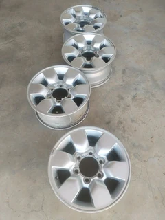 15 inch t o y o t a h i l l u x magrims 6 holes w t h n o c e n t r e c a p s a set of four on sale