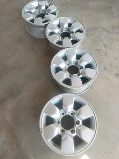 15 inch t o y o t a h i l l u x magrims 6 holes w t h n o c e n t r e c a p s a set of four on sale