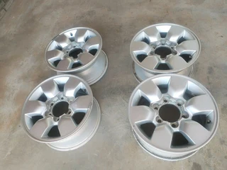 15 inch t o y o t a h i l l u x magrims 6 holes w t h n o c e n t r e c a p s a set of four on sale