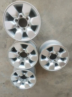 15 inch t o y o t a h i l l u x magrims 6 holes w t h n o c e n t r e c a p s a set of four on sale