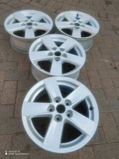 16 inch m i t s u b i s h i magrims 5 holes  Wth NO CENTRE CAPS a set of four on sale