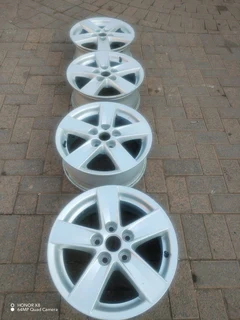 16 inch m i t s u b i s h i magrims 5 holes  Wth NO CENTRE CAPS a set of four on sale