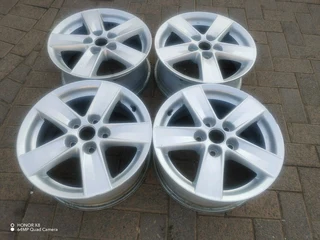16 inch m i t s u b i s h i magrims 5 holes  Wth NO CENTRE CAPS a set of four on sale
