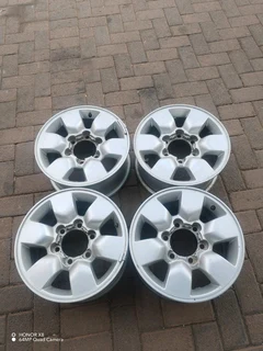 15 inch t o y o t a h i l l u x magrims 6 holes w t h n o c e n t r e c a p s a set of four on sale