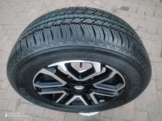 O n e 265 60 r18 b r i d g e s t o n e d u e l e r tyre &amp; 18 inch f o r d magrim on sale