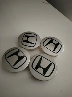 Honda Wheel Center Caps A Set Of Four On Sale.