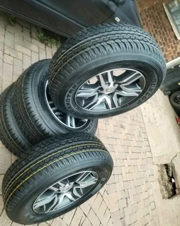 17Inch TOYOTA FORTUNA Magrims 6Holes &amp; DUNLOP GRAND TREK Tyres 265/65R17 A Set of four on sale.