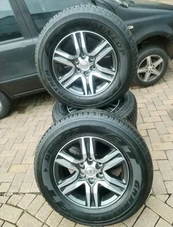 17Inch TOYOTA FORTUNA Magrims 6Holes &amp; DUNLOP GRAND TREK Tyres 265/65R17 A Set of four on sale.