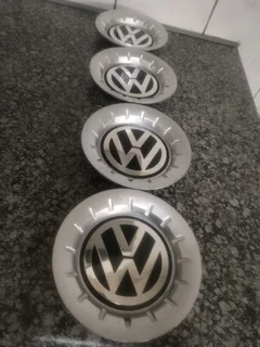 POLO VOLKSWAGEN Wheel Centre Caps A Set of four on sale.