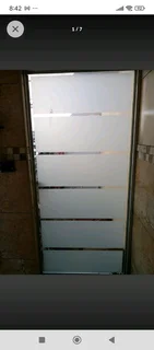 Glass tinting and decorative sandblasting