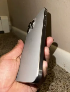 Pre owned iPhone 15 pro max 512gb natural titanium.