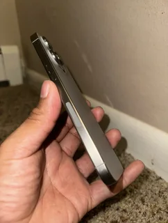 Pre owned iPhone 15 pro max 512gb natural titanium.